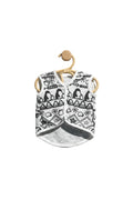 Black and white patterned shirt on a wooden hanger against a light gray background