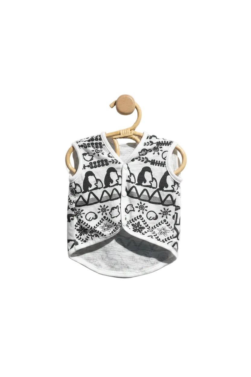 Black and white patterned shirt on a wooden hanger against a light gray background